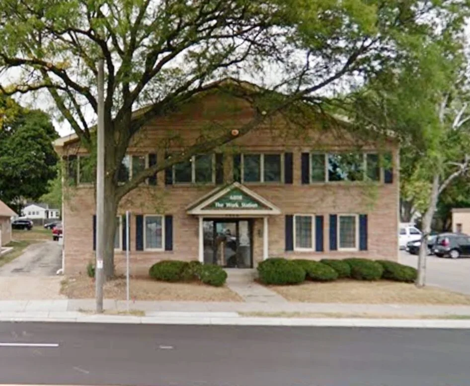 The brick building at 6808 University Avenue in Middleton that houses Hair Garden Salon Suites, seen from the street.